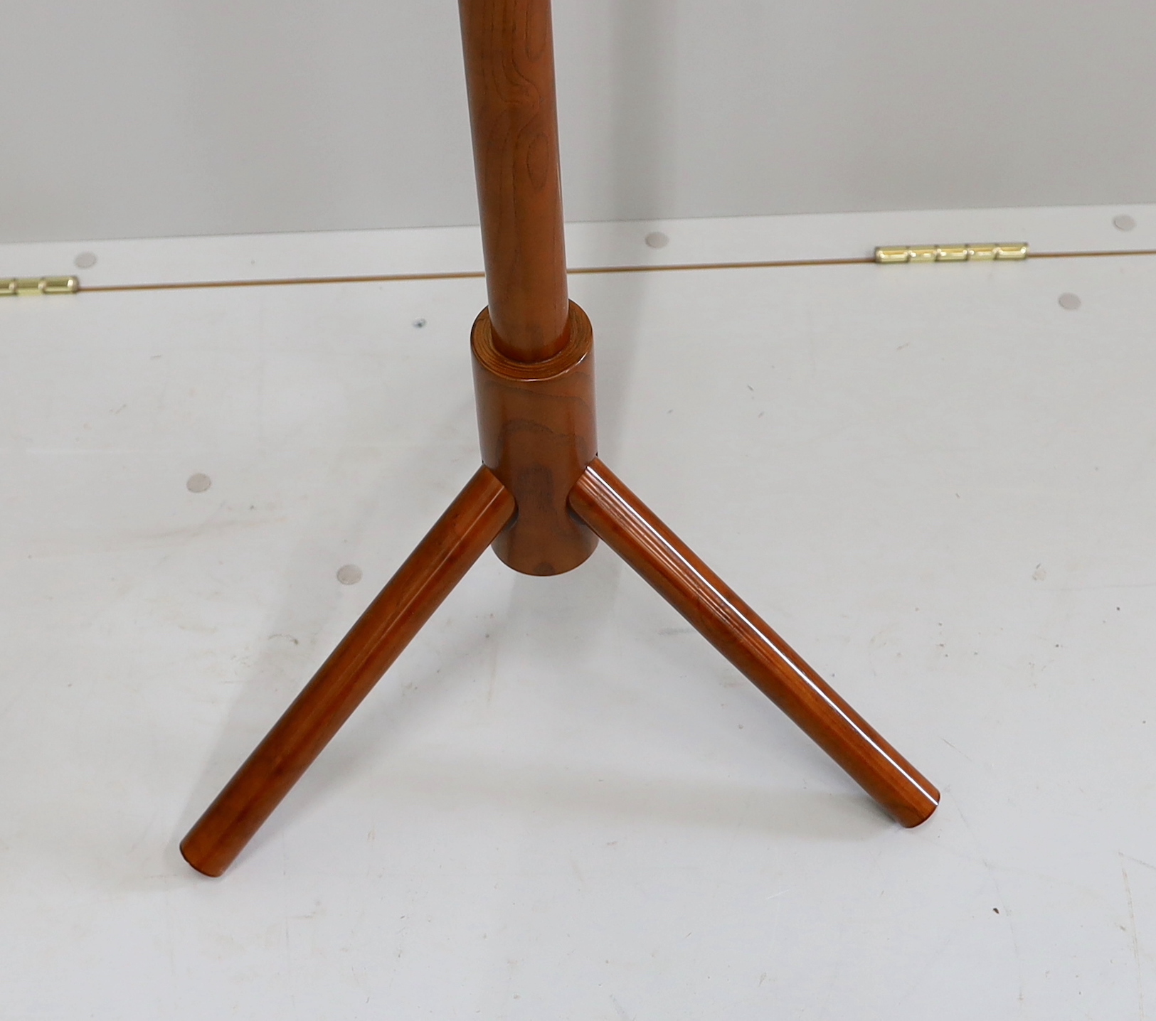A mid century design teak nine peg clothes tree, height 178cm